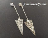 Discover the exquisite craftsmanship of Armenian handmade jewelry. Made from high-quality sterling silver 925, these extra long chain earrings-studs feature a unique taraz ornament design and arevakhach symbol, adding an ethnic touch to your style. Elevate your look with these unusual and stunning women's jewels. You can buy these long earrings with affordable prices at our Armenian online store.