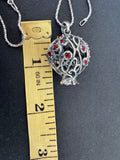 Discover the perfect holiday gift with our bestseller high quality silver jewelry. Handcrafted with a modern pomegranate net design, this pomegranate pendant with red stones is a unique and elegant addition to any jewelry collection. Buy online for a convenient and hassle-free purchase.
