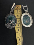 Upgrade your jewelry collection with our one of a kind silver earrings adorned with marcasite and oval moss agate gemstones. At 5 centimetres in length, these feminine and classic earrings make the perfect statement piece. Add a touch of elegance and uniqueness to any outfit. Perfect for grandma or anyone looking for a one of a kind piece.