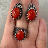 Experience luxury and uniqueness with our artisan crafted sterling silver 925 stamped jewelry. Adorned with a bright orange almost red agate natural gem, this one-of-a-kind set of earrings and ring will add a touch of elegance to any outfit. Elevate your style with our high quality jewelry. Buy rough silver jewelry set made with natural oval gemstones.