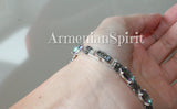 Next, let's discuss marcasite. Marcasite is a mineral that is often mistaken for a gemstone, but it is actually a form of iron sulfide. It has a beautiful metallic luster and is often used in jewelry as an alternative to more expensive materials like diamonds or gold. Marcasite is known for its durability and resistance to tarnish. Buy bracelet with green stones and marcasite.