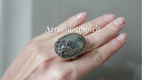 This handmade Armenian jewelry is crafted from sterling silver and features a stunning moss agate green gemstone ring adorned with marcasite flowers. The oval large cabochon adds a vintage touch, making it perfect for retro jewelry lovers. Elevate your style and indulge in this piece fit for a rich woman.