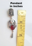 Elevate your style with our stunning 925 silver jewelry from Armenia. Our high-quality pomegranate pendant boasts a 2-inch size, adding an elegant touch to any outfit. Discover the beauty and craftsmanship of Armenia with every wear.