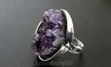 Imagine a statement piece, not merely a ring, but a miniature landscape captured on your finger. This is no ordinary gemstone; it's a very big amethyst drusy geode, a breathtaking expanse of deep purple crystals that shimmer and dance with light. Each tiny facet of the drusy catches the eye, creating a mesmerizing sparkle. The natural formation of the amethyst is juxtaposed with the handcrafted setting of gleaming sterling silver, 925 purity ensuring both lasting beauty and strength.