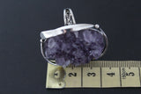 This magnificent ring is a true statement piece, showcasing a one-of-a-kind amethyst drusy purple geode gemstone. The raw, natural beauty of the geode is captivating, with its myriad of tiny, sparkling crystals creating a breathtaking depth of color and texture. The deep, rich purple hues are mesmerizing, shifting and shimmering with every change in light. Encased in hand-worked sterling silver 925, the ring is a testament to the skill and artistry of Armenian artisan. Each curve and detail is meticulously.