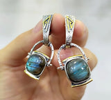 Elevate your style with our high-quality sterling silver 925 jewelry from Armenian Spirit. Our Labradorite natural gemstone dangle earrings are the perfect accessory for any occasion, especially for a blue dress on vacation. Enjoy free worldwide shipping and discounts while bringing love into your life with this beautiful birthstone piece.
