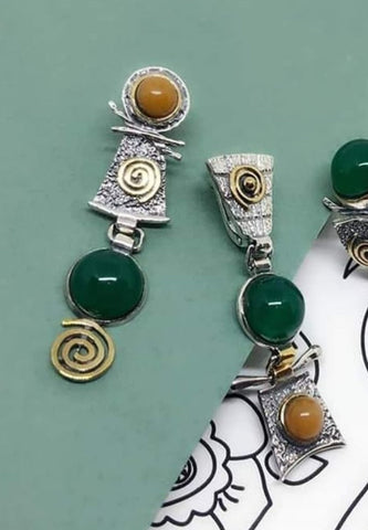 buy jade green gestone assymetrical earrings made of sterling silver 925 and yellow jadeite round gems. The earrings are Armenian and has gilded eternity symbols on them.