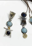 Blue gemstones with different tings earrings silver with gold plated details.