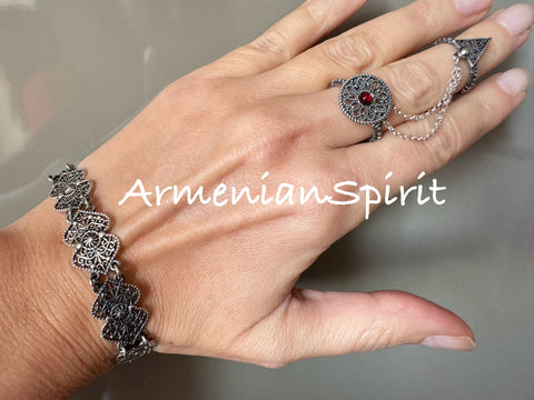 Elevate your style with our high-quality sterling silver jewelry from Armenian Spirit. This filigree lace bracelet and double ring feature a stunning red stone, perfect for fingers of sizes 6-9. Upgrade your look with our online store and enjoy exclusive discounts.

