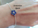 Discover the beauty of Armenian culture with our 925 silver jewelry. This exquisite bracelet features a purple "forget-me-not" flower, a symbol of the Armenian genocide. Hypoallergenic and adorned with charming violet flowers, it's a high-quality piece that will make a meaningful addition to any collection. Buy online now.
