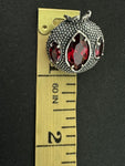 This stunning pomegranate brooch features a ruby red transparent stone set in a 925 sterling silver design. Handmade with traditional Armenian techniques, this 1 inch pin brooch is a unique addition to any jewelry collection. Celebrate Armenian culture and add a touch of elegance with this beautiful piece.

