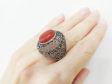 buy marcasite vintage silver filigree ring with carnelian gemstone oval cabochon. This large dome ring is made with small marcasite gemstones and oval brown carnelian gemstone cabochon.