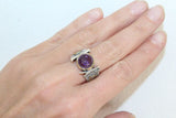 Purple amethyst has a power of love and brings a lot of love to a woman who wesrs amthyst ring. This ring is made of fine silver. The parts of sthis sterling rings are gold plated and the gemstones is round purple amethyst. The ring is not too large. It is very delicate and has middle size gemstone.