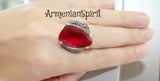 Add a touch of vintage elegance to your jewelry collection with our sterling silver 925 red stone ring. Featuring a stunning red faceted stone, this classic and eye-catching piece is perfect for parties and open-air cafes. With free worldwide shipping and discounts available, it's the perfect accessory to pair with your favorite red dress.
