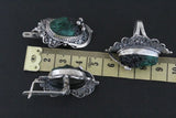 Armenian jewelry set with green and black drusy gemstones on a black background, measured against a ruler.