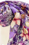 Floral merino wool shawl with purple and pink flowers on a white background