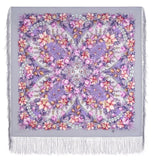 Floral patterned scarf with fringe on a white background