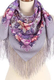 Floral patterned merino wool scarf with purple and pink colors on a mannequin