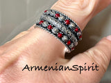 This high quality silver jewelry features a band ring with red dots, making it the perfect complement to any red and white polka dot outfit. Crafted with precision, this silver jewelry is a stylish and versatile addition to your accessories collection. Elevate your look with the perfect touch of elegance and charm. Buy traditional daraz Western Armenian inspired sterling j
elry from Armenia.