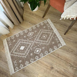 Decorative Armenian rug with geometric ethnic pattern on a wooden floor