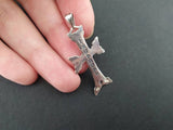 Armenian silver cross reverse side showing St Echmiadzin title on a women`s hand.