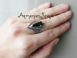 Silver ring with pointed black topaz stone and marcasite pirite gemstones.
