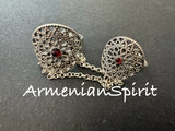 Expertly handcrafted by Armenian artisans, this Sterling Silver 925 Armenian double ring features a stunning red stone and intricate traditional detailing. Made from high-quality silver 925, this unique piece showcases the beauty and craftsmanship of Armenian jewelry. Elevate your style with this timeless and one-of-a-kind accessory.
