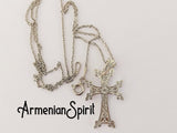 A silver Armenian cross necklace with intricate designs and arevakhach eternity symbol, displayed against a white background with 'ArmenianSpirit' written at the bottom.
