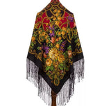 Colorful oversized merino wool like cashmere shawl with floral peony patterns and fringes on a white background