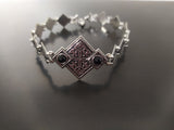 Ethnic bracelet with black stones and Armenian traditional ornament