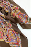 Brown woolen scarf with colorful paisley pattern on a white background