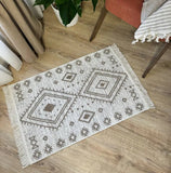 Decorative rug with geometric pattern on a wooden floor