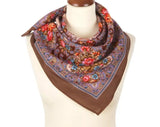 Merino wool brown scarf with vintage peony floral patterns on a mannequin against a white background