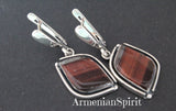 Unleash your bold side with these unique handmade tiger's eye earrings from Armenia. The artisan craftsmanship and high quality sterling silver 925 make these eye-shaped dangles stand out. Each pair is one-of-a-kind and features a stunning brown stripped gemstone. Channel your adventurous spirit with this must-have jewelry piece!
