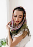 Buy this elegant khaki and beige woolen shawl with fringe for everyday warmth. Worn by a woman, it offers a non-prickly feel and timeless style.