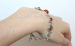 This elegant bracelet is expertly crafted from high quality sterling silver (925 stamp) and features a beautiful amber orange gemstone with a honey hue. The modern geometric design adds a touch of sophistication to any outfit. Elevate your style with the colorful natural gemstones in this stunning piece.
