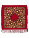 Red floral patterned scarf with gold accents on a white background. The natural sheep wool fabric is rich red, finished with fringe and floral peonies in yellow and pink.