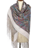 A large merino wool blanket shawl with gray, ivory, and blue Slavic patterns, draped on a clothing mannequin. An oversized winter palantine made of soft merino wool, showcasing an intricate Slavic folk pattern in gray, ivory, and blue on a studio mannequin.