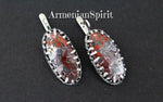 In the world of jewelry, where trends come and go, there’s a timeless appeal to pieces that are not only beautiful but also tell a story. Enter these stunning earrings, meticulously crafted from sterling silver and showcasing the mesmerizing beauty of Mexican lace agate, also known as crazy lace agate. These are more than just adornments; they are a testament to artistry, heritage, and the unique spirit of Armenian design.

