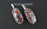 In the world of jewelry, where trends come and go, there’s a timeless appeal to pieces that are not only beautiful but also tell a story. Enter these stunning earrings, meticulously crafted from sterling silver and showcasing the mesmerizing beauty of Mexican lace agate, also known as crazy lace agate. These are more than just adornments; they are a testament to artistry, heritage, and the unique spirit of Armenian design.

