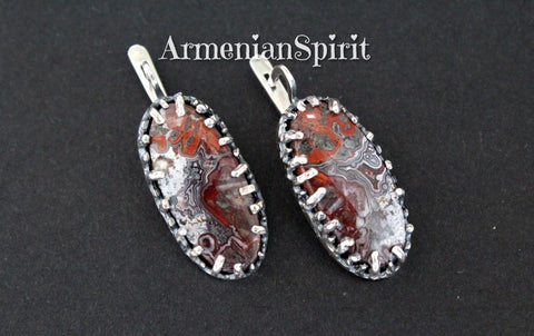 In the world of jewelry, where trends come and go, there’s a timeless appeal to pieces that are not only beautiful but also tell a story. Enter these stunning earrings, meticulously crafted from sterling silver and showcasing the mesmerizing beauty of Mexican lace agate, also known as crazy lace agate. These are more than just adornments; they are a testament to artistry, heritage, and the unique spirit of Armenian design.

