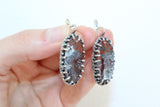 Mexican or crazy lace agate is The best talisman will be for women and men born under the signs of Capricorn, Aquarius and Libra. The mineral also favors those born under the zodiac signs of Taurus and Gemini. These particular earrings, featuring the captivating Crazy Lace Agate, are an ideal choice for anyone seeking a piece that is both eye-catching and deeply meaningful. They are perfect for adding a touch of bohemian elegance to an everyday outfit or complementing a more formal ensemble.