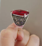 Expertly crafted from high-quality sterling silver 925, this extra large red ring is a true statement piece. This sterling silver ring boasts a vintage-inspired design with a bold and eye-catching red transparent stone. Perfect for parties at open cafes, this piece adds a touch of Armenian charm to any red luxury dress with open shoulders and neckline. Its shiny, faceted stone makes it a timeless and classic addition to any jewelry collection. Free shipping and discounts available worldwide.
