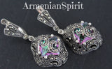 Small dangle earrings with marcasite on a black surface with Armenian Spirit title.