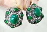 Dome earrings with multiple green stones and marcasite