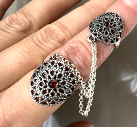 Handmade with precision, this traditional Armenian jewelry features a striking double ring design with a vibrant red stone. Crafted from high quality silver 925, it exudes authentic elegance. Perfect for adding a touch of cultural charm to any outfit.

