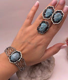 One of a kind handmade  Armenian jewelry set earrings, ring and bracelet on a wrist made from natural blue turquoise and oxidized black sterling silver 925.