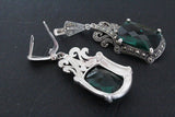 Very long earrings with marcasite and emerald green faceted stones
