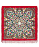 Colorful floral and paisley patterned Spanish flamenco style merino wool scarf on a red background