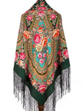 An oversized merino wool shawl in sea green, with turquoise details and pink peony flowers, inspired by traditional floral Slavic folk designs. Comfortable, warm, and beautifully detailed with silky long fringe.
